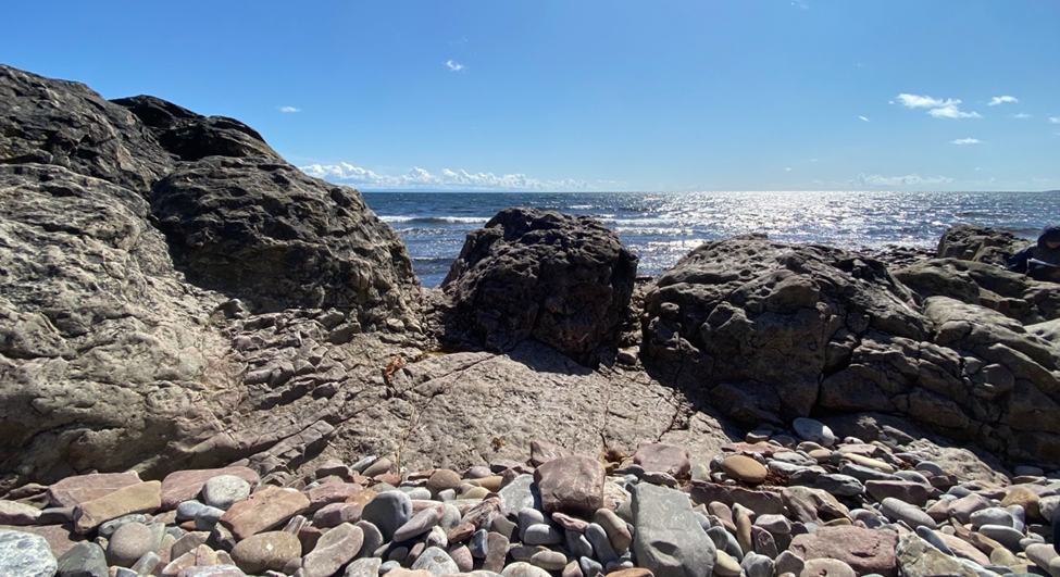 a landscape of seaside rocks on a sunny day